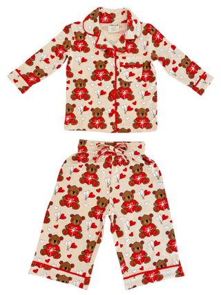 The SpearmintLOVE Lounge Set - Valentine Bear includes a beige top and pants with bears holding red hearts and lollipops, accented by red piping. Ideal for family matching, its shown on a white background. Perfect for cozy nights!.