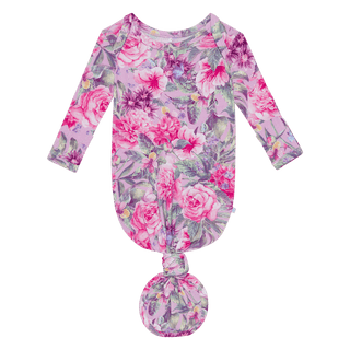 The Bamboo Basic Knotted Gown - Ellery (Floral) by Posh Peanut features long sleeves, a knotted bottom for easy diaper changes, and no-scratch mittens. Its adorned with pink and purple flowers alongside green leaves for an enchanting touch.